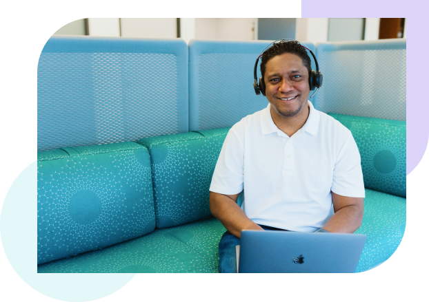WordPress customer support man with headset at laptop