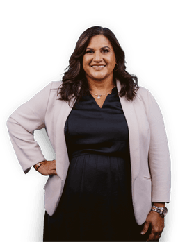 Professional woman in a blazer facing forward and smiling