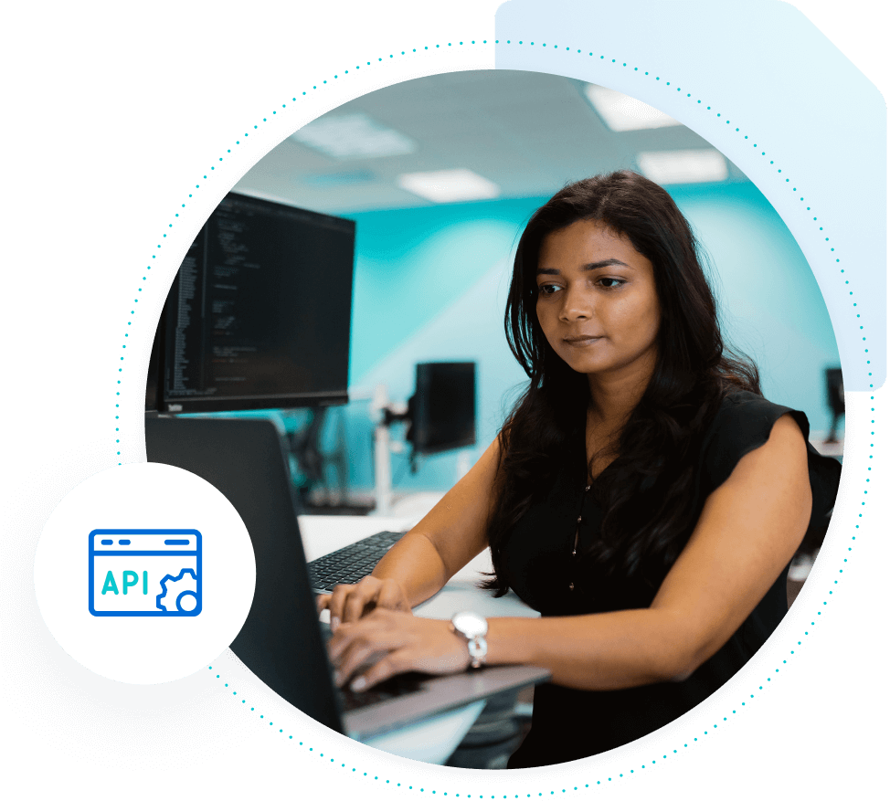 Woman on laptop with API icon hovering next to her