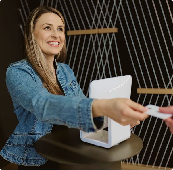 Image of woman making WooCommerce payment with credit card