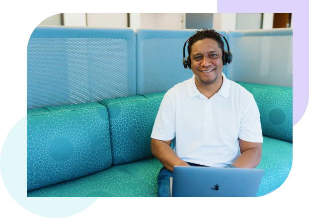 WordPress customer support man with headset at laptop
