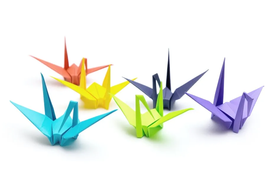 Group of six colorful origami paper cranes