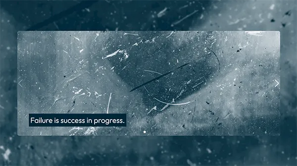 Failure is a success in progress text on concrete background