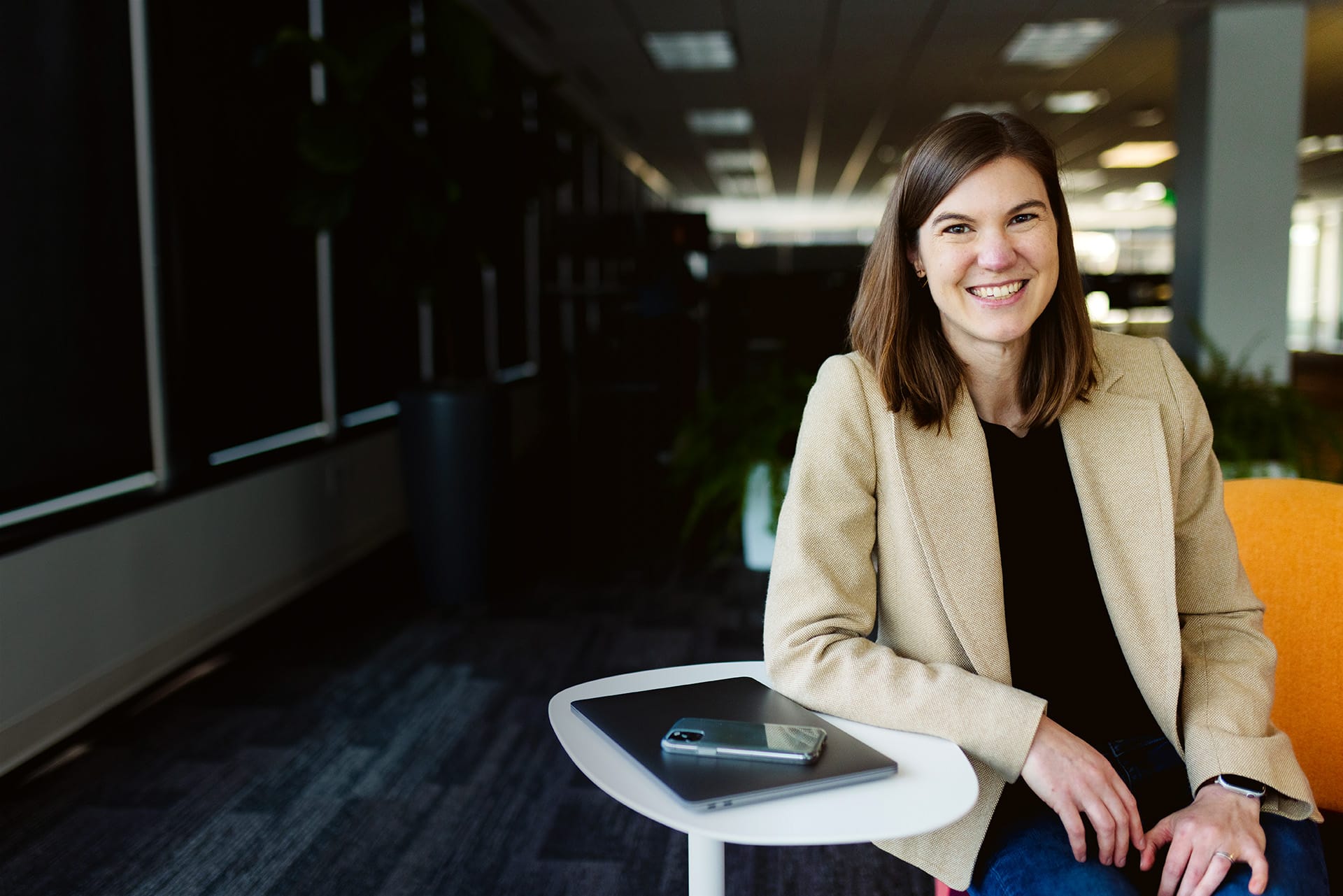 WP Engine Manager, Engineering smiling at desk