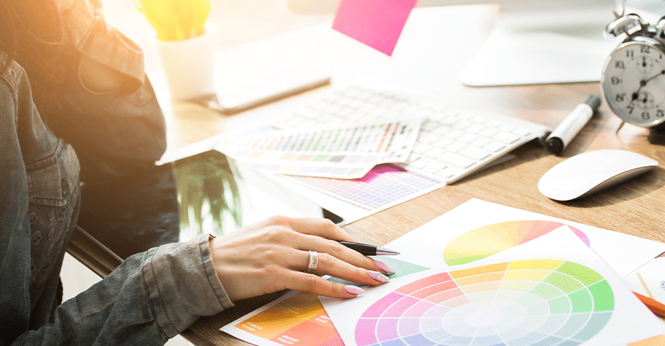 designer working with color palettes at desk
