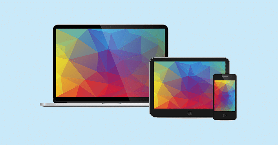 a laptop, a tablet, and a phone, each displaying the same theme
