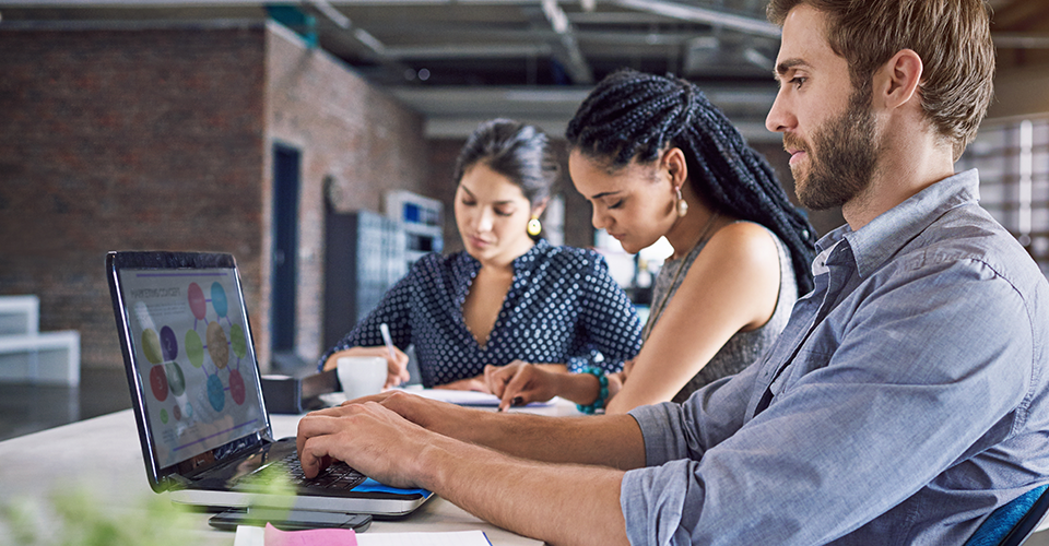 three wordpress users on their computers