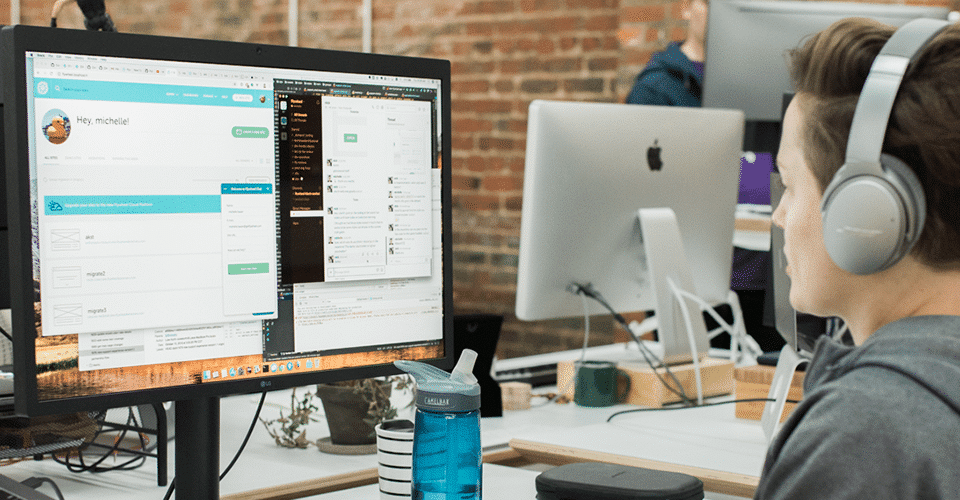 Web developer working on desktop computer