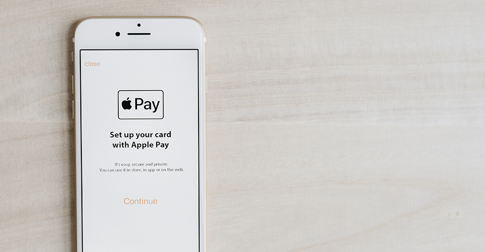 How to set up apple pay on WordPress. Image shows an iPhone with the Apple Pay setup screen