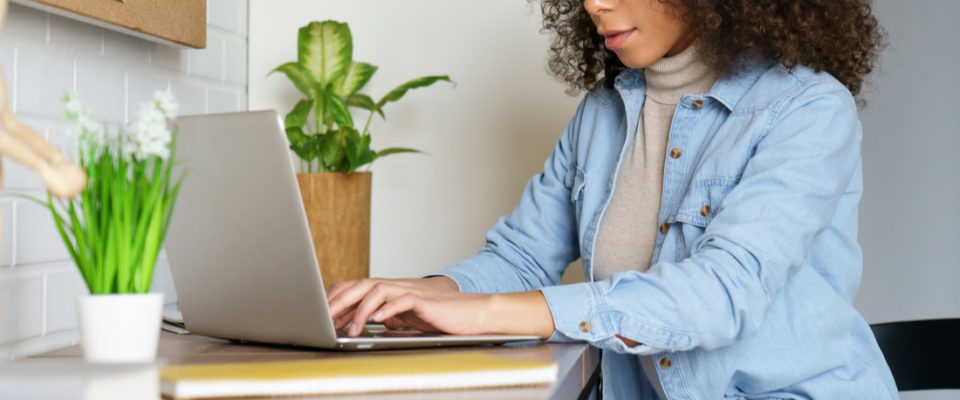 young woman student freelancer distance worker using laptop