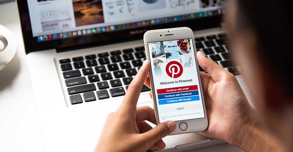 How to use Pinterest with WordPress. image shows a person signing into Pinterest on mobile