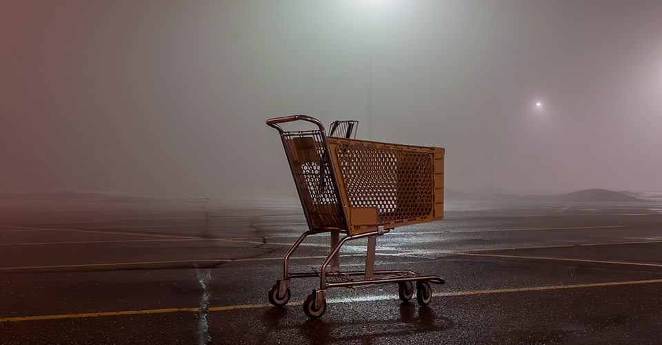 WooCommerce Abandoned Cart Recovery. image depicts an abandoned cart in a parking lot.