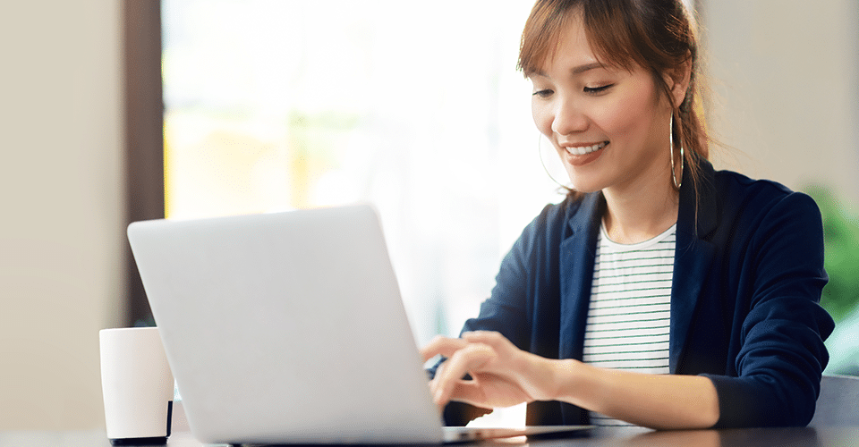 a woman uses cPanel on a laptop