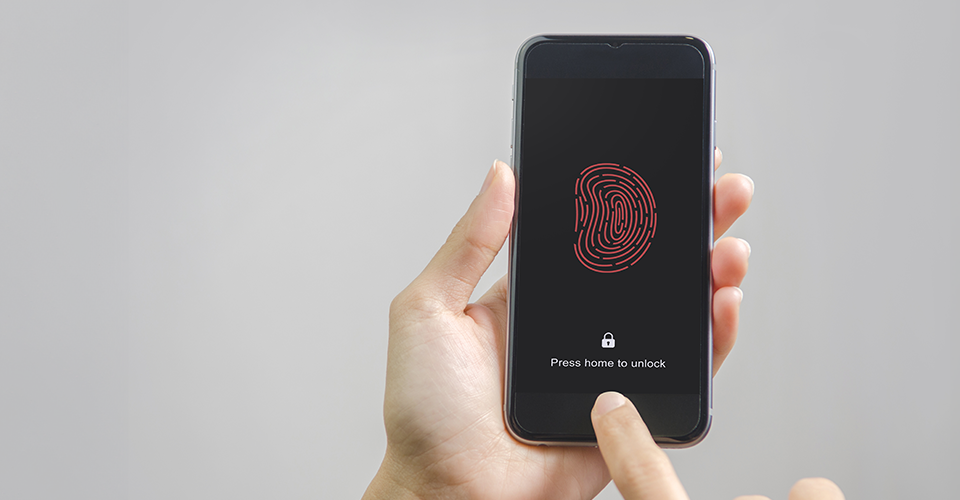 hands setting up index fingerprint for multi-factor authentication on a mobile device