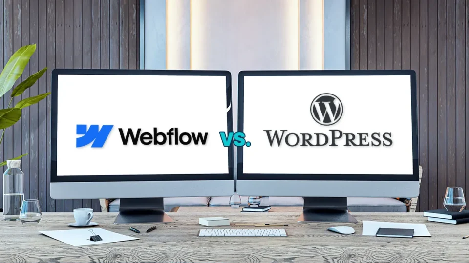 An image of two computer monitors, one with the Webflow logo and the other with the WordPress logo.
