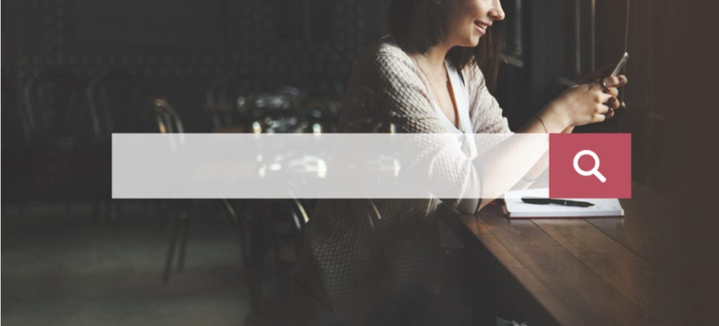 How to Add Autocomplete Search to Your WordPress Site. search bar overlaying woman using mobile phone