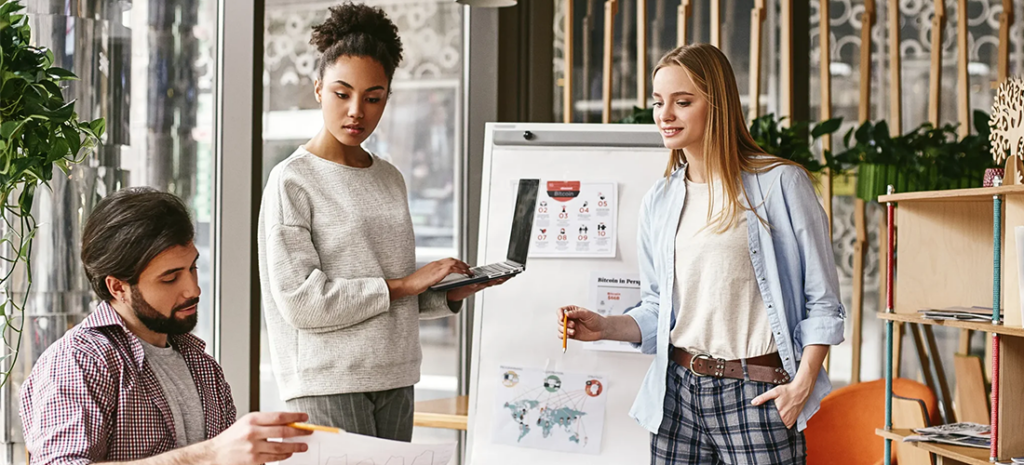 A creative meeting between three professionals. Headless architecture for agencies can streamline workflows while providing unique, memorable experiences for clients.