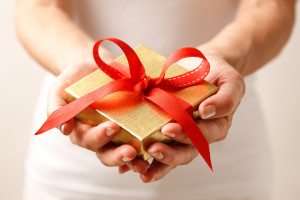 Woman giving a gift box