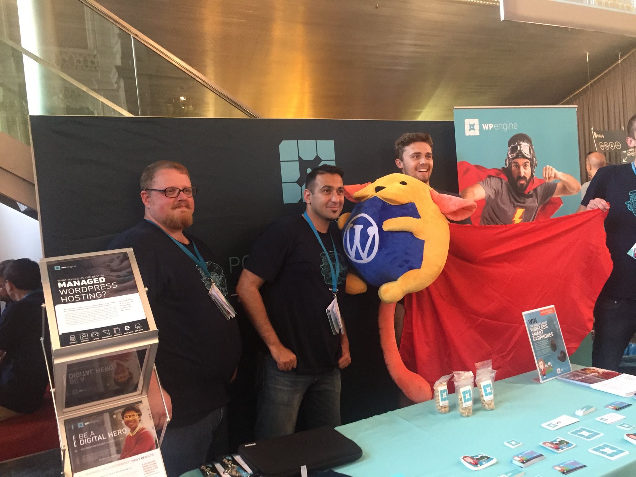 The WP Engine UK team poses with Wapuu, the official WordPress mascot. 