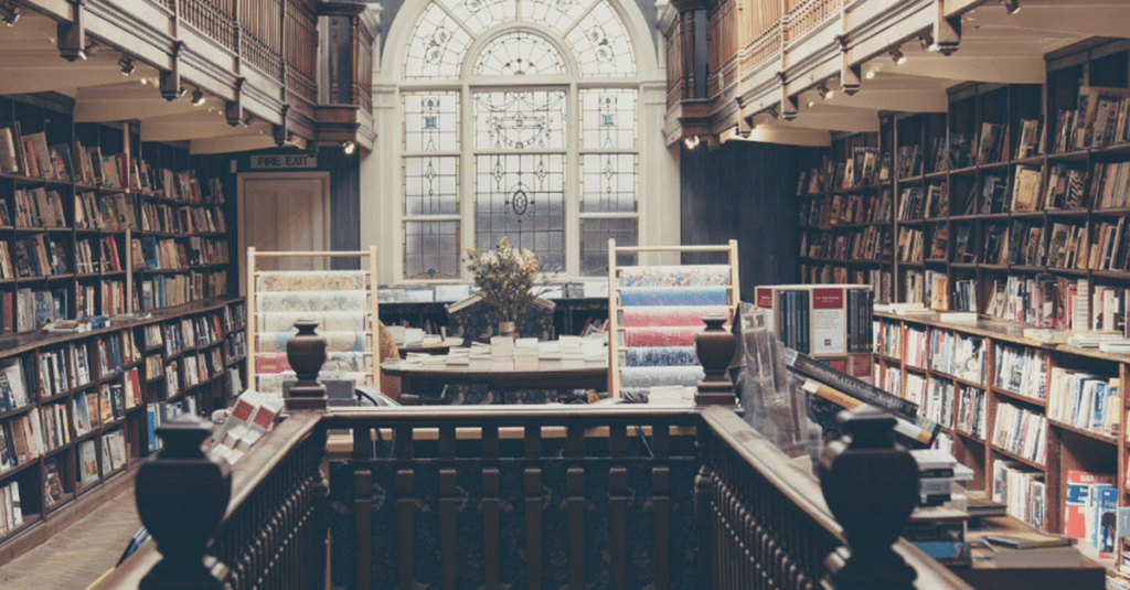 the view from inside a library looking out an ornate arched window