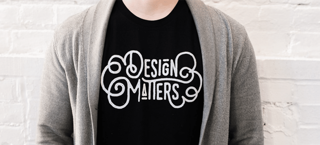 a person wears a black t-shirt displaying the phrase Design Matters
