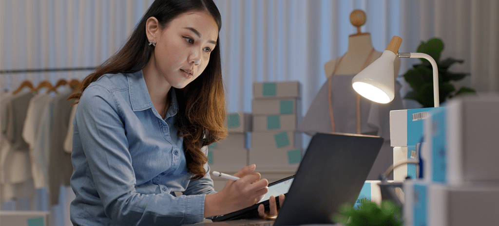 WordPress for eCommerce, image depicts a woman double checking an eCommerce order placed on her website