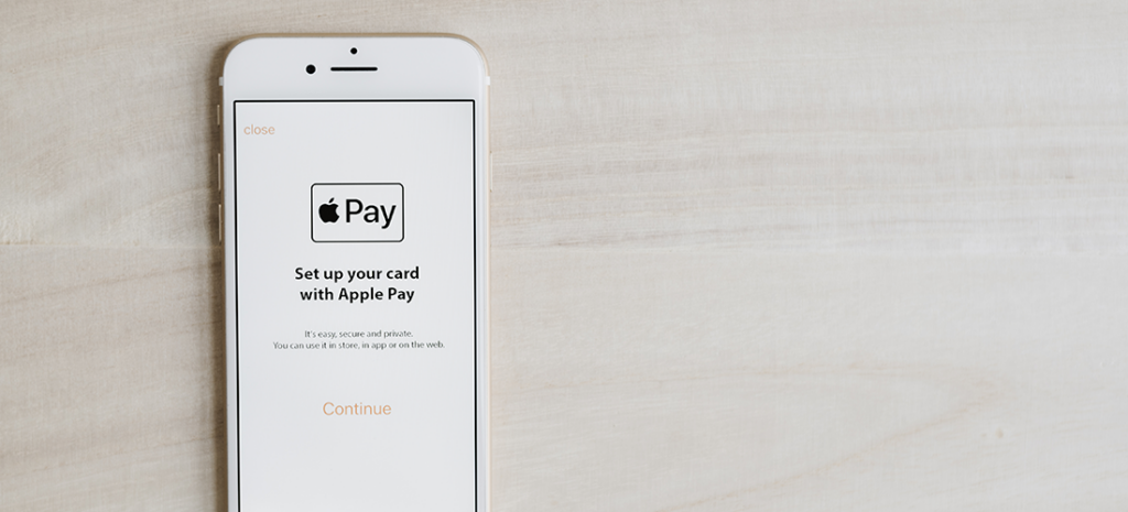 How to set up apple pay on WordPress. Image shows an iPhone with the Apple Pay setup screen