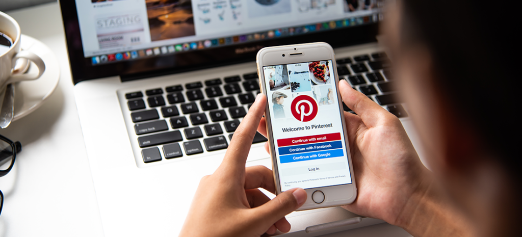 How to use Pinterest with WordPress. image shows a person signing into Pinterest on mobile
