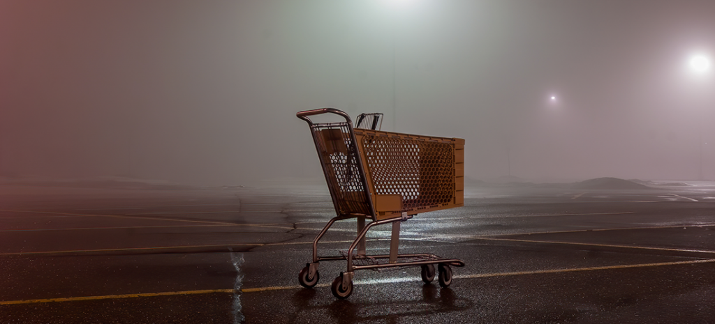 WooCommerce Abandoned Cart Recovery. image depicts an abandoned cart in a parking lot.