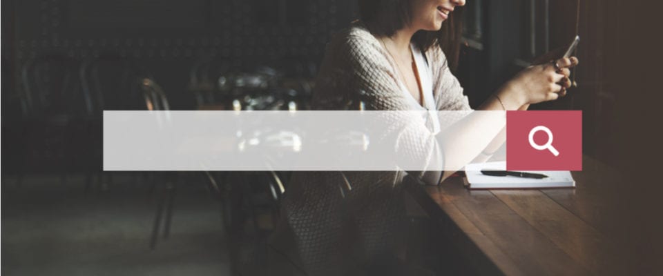 How to Add Autocomplete Search to Your WordPress Site. search bar overlaying woman using mobile phone