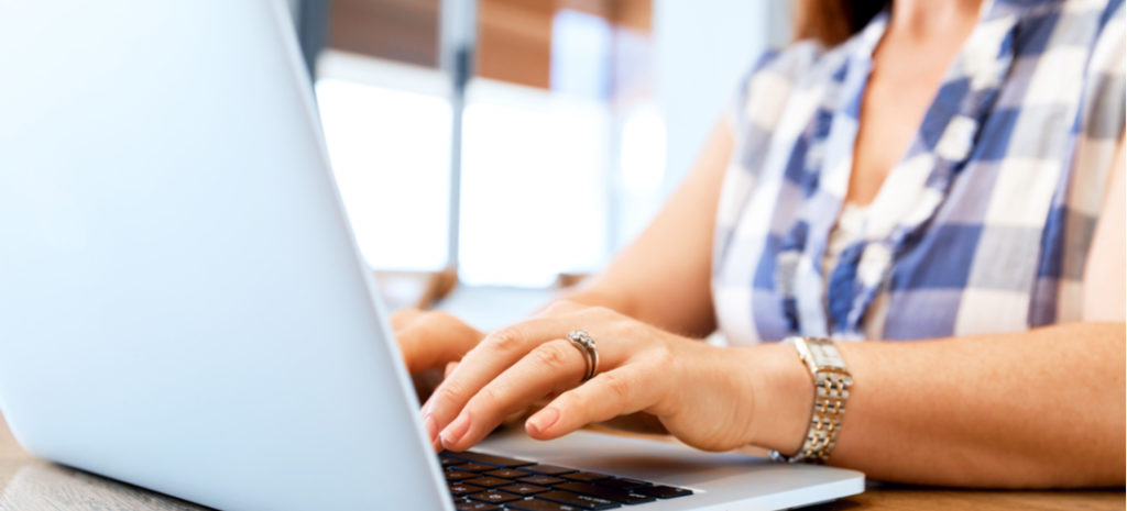 woman typing on laptop