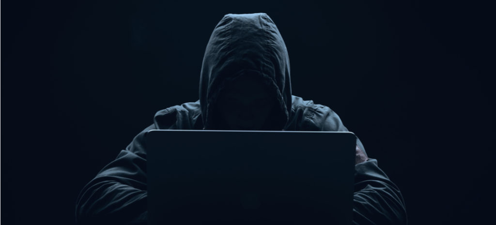 male hacker wearing hooded jacket