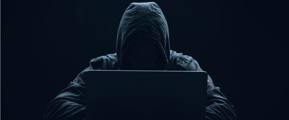 male hacker wearing hooded jacket