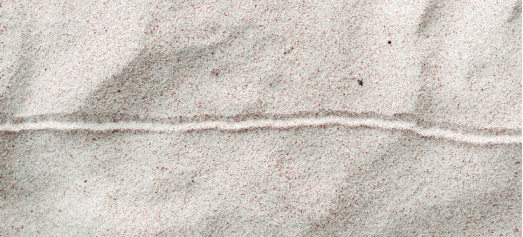Image of a horizontal line drawn in the sand