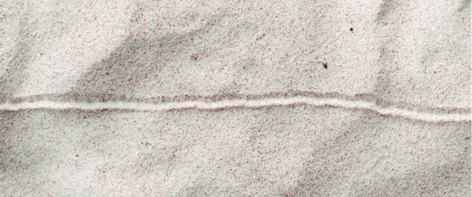 Image of a horizontal line drawn in the sand