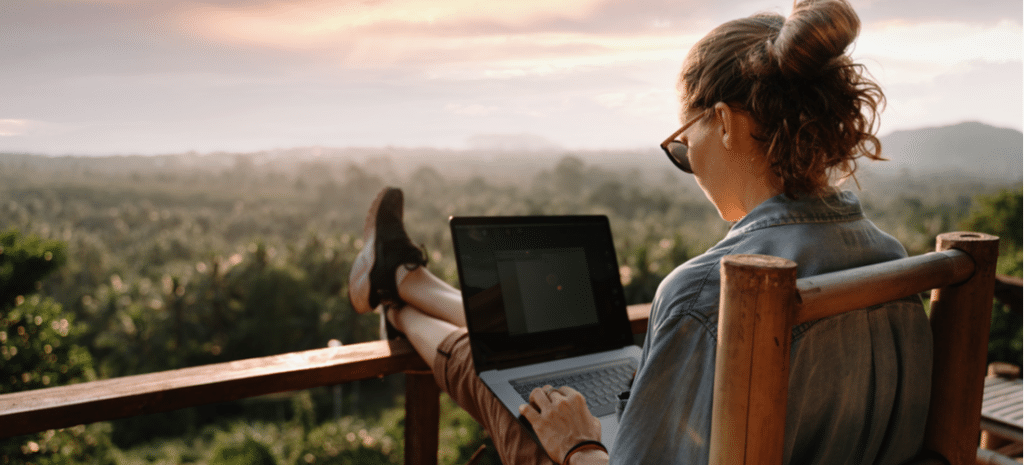 Woman using laptop on deck WordPress design