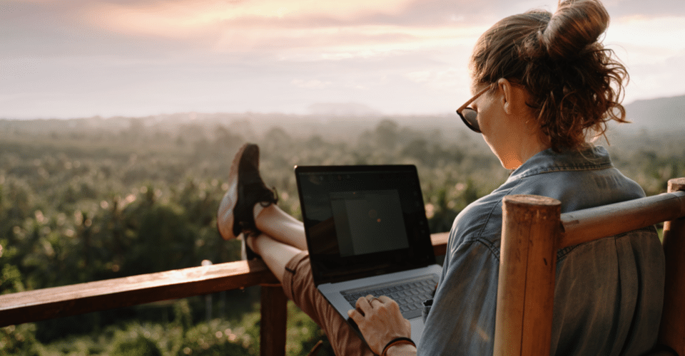 Woman using laptop on deck WordPress design. WordPress bootstrap