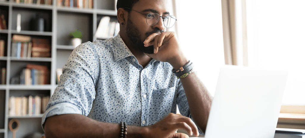 a man works on a laptop