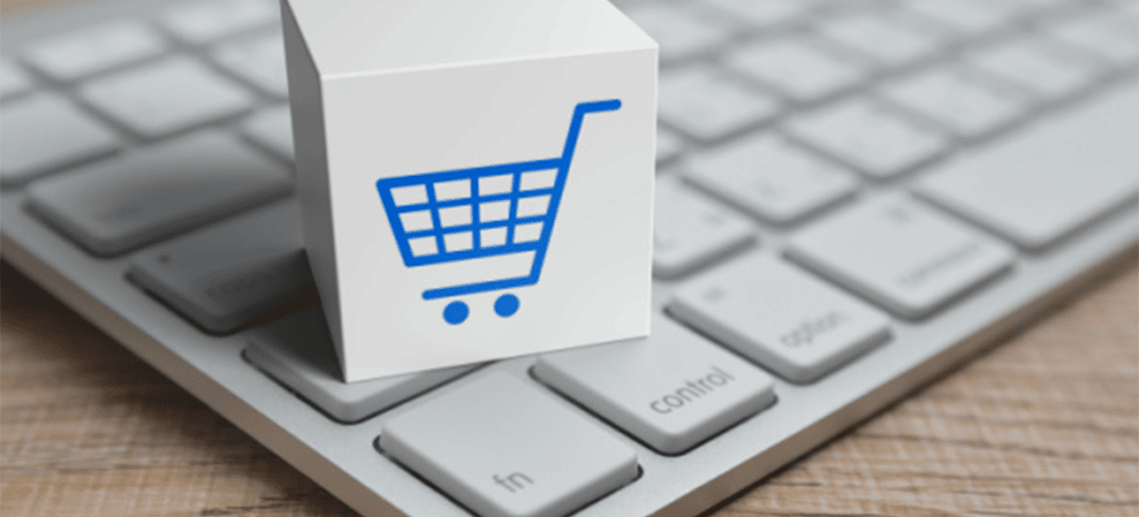 eCommerce shopping cart icon on top of a keyboard