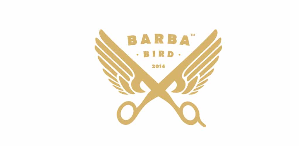Logo for a company called Barba Bird in which the company name is situated between the blades of a pair of winged barber scissors