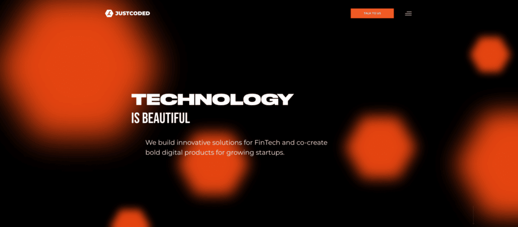 A screenshot of the homepage for JustCoded, one of the best agency websites