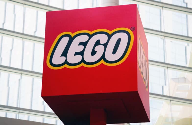 Block-shaped street signage emblazoned with the Lego logo
