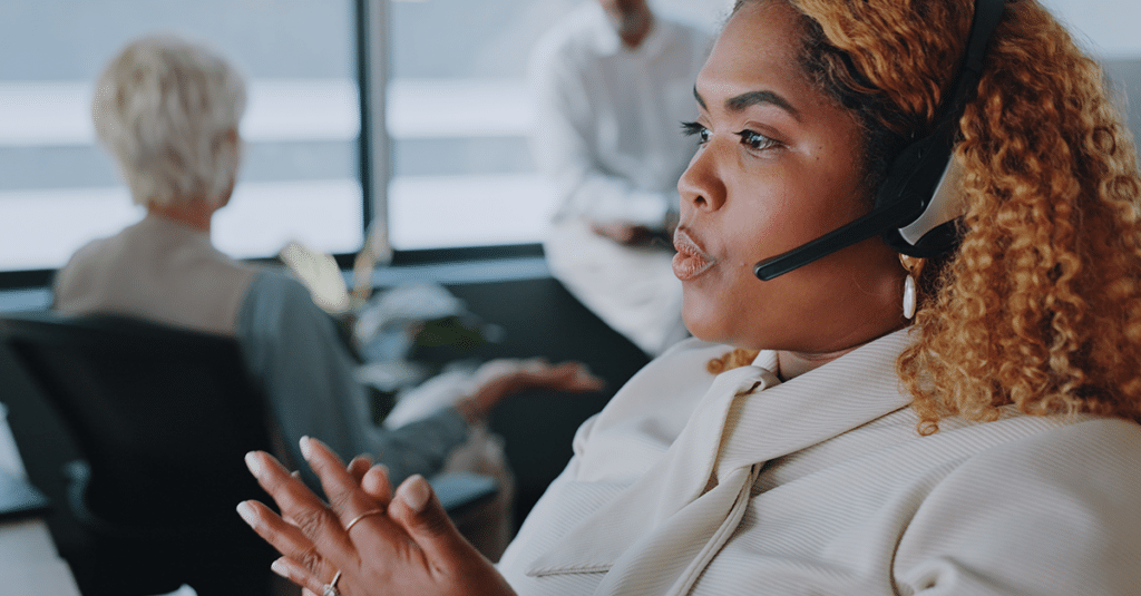 Woman speaking on the phone with a client. 