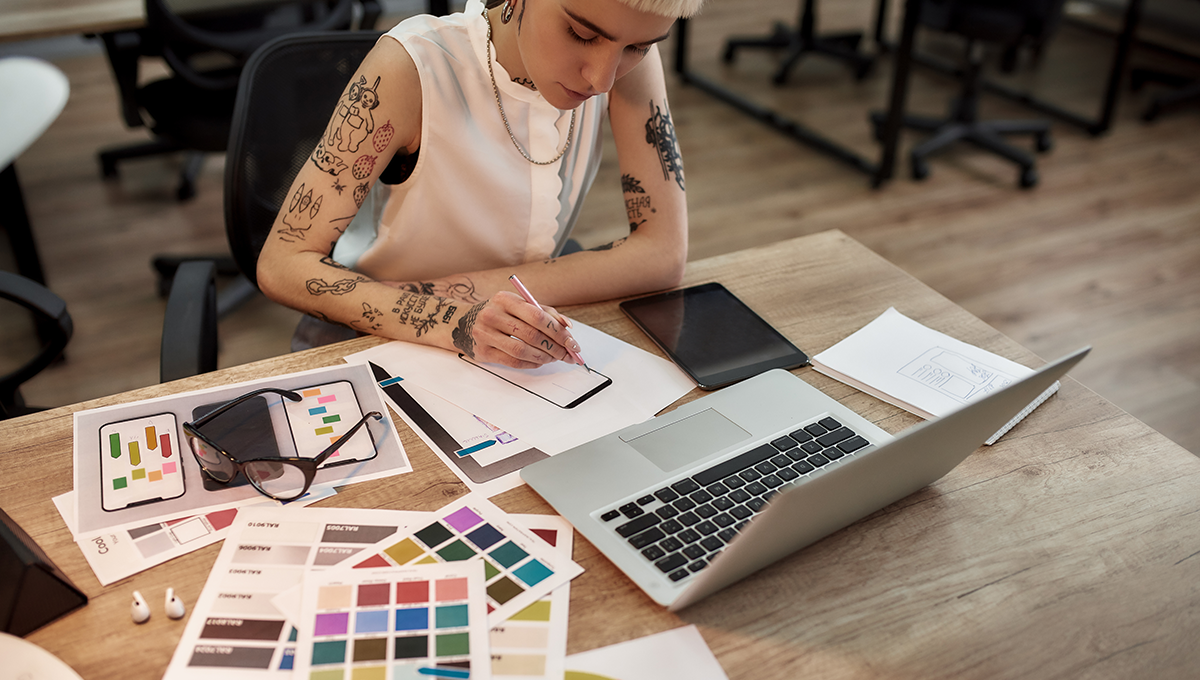 11 web design trends to watch in 2024. A web designer plans the look of a new website at a desk