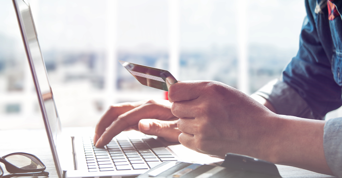 A person enters their credit card information to make a transaction online