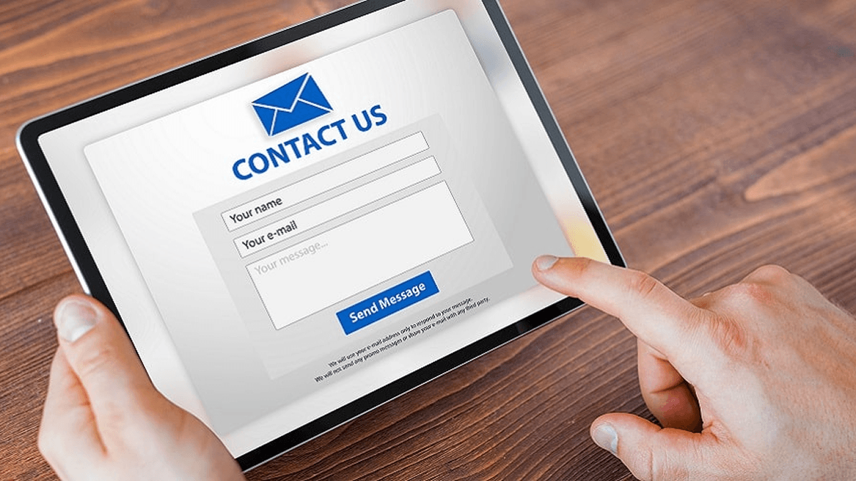 Man submitting contact form on website